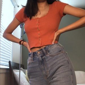 rust colored crop top with lace detail